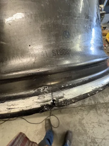 Close-up of the Alfa Romeo wheel's inner bead seat with the crack welded and ground