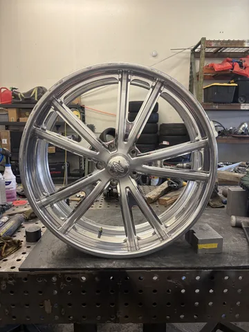 The same billet Intro wheel after repair, straight and refinished on the workbench